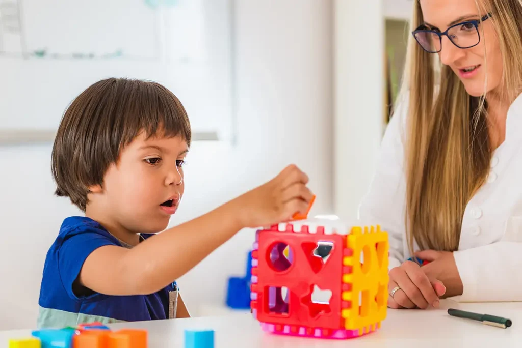 Child development therapist observing little boy's behavior before ABA Therapy - Collinsville, IL